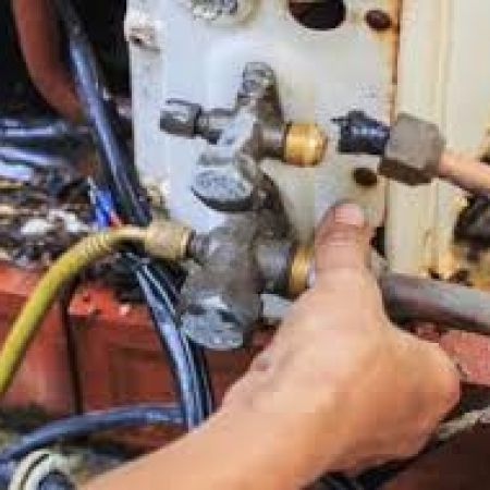 JRL HVAC Installer working on an HVAC unit